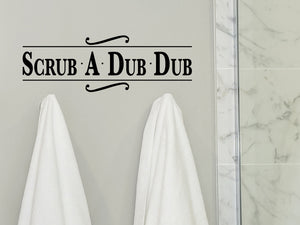 Wall decals for bathroom that say ‘scrub a dub dub’ on a bathroom wall.