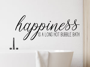 Wall decals for the bathroom that say ‘happiness is a long hot bubble bath’ on a bathroom wall.