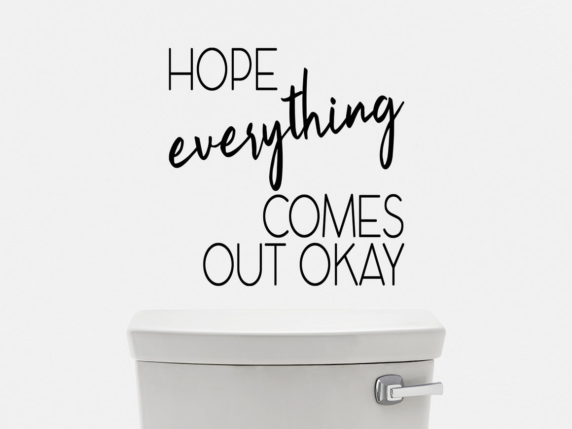 Wall decals for the bathroom that say ‘hope everything comes out okay’ on a bathroom wall.