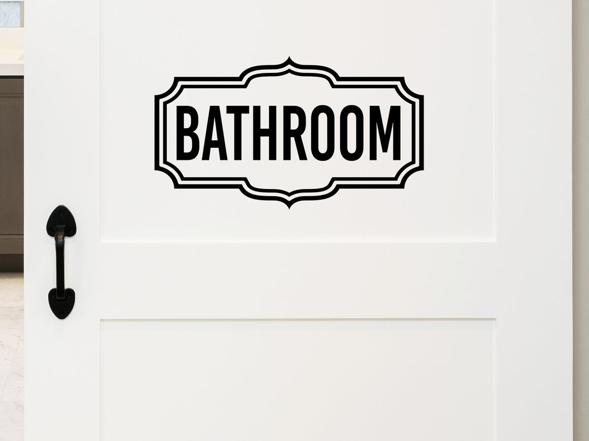 Wall decals for bathroom that say ‘Bathroom’ with a scallop design on a bathroom wall.