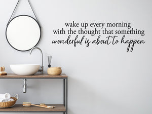 Wall decals for bathroom that say ‘Wake Up Every Morning With The Thought’ in a script font on a bathroom wall.