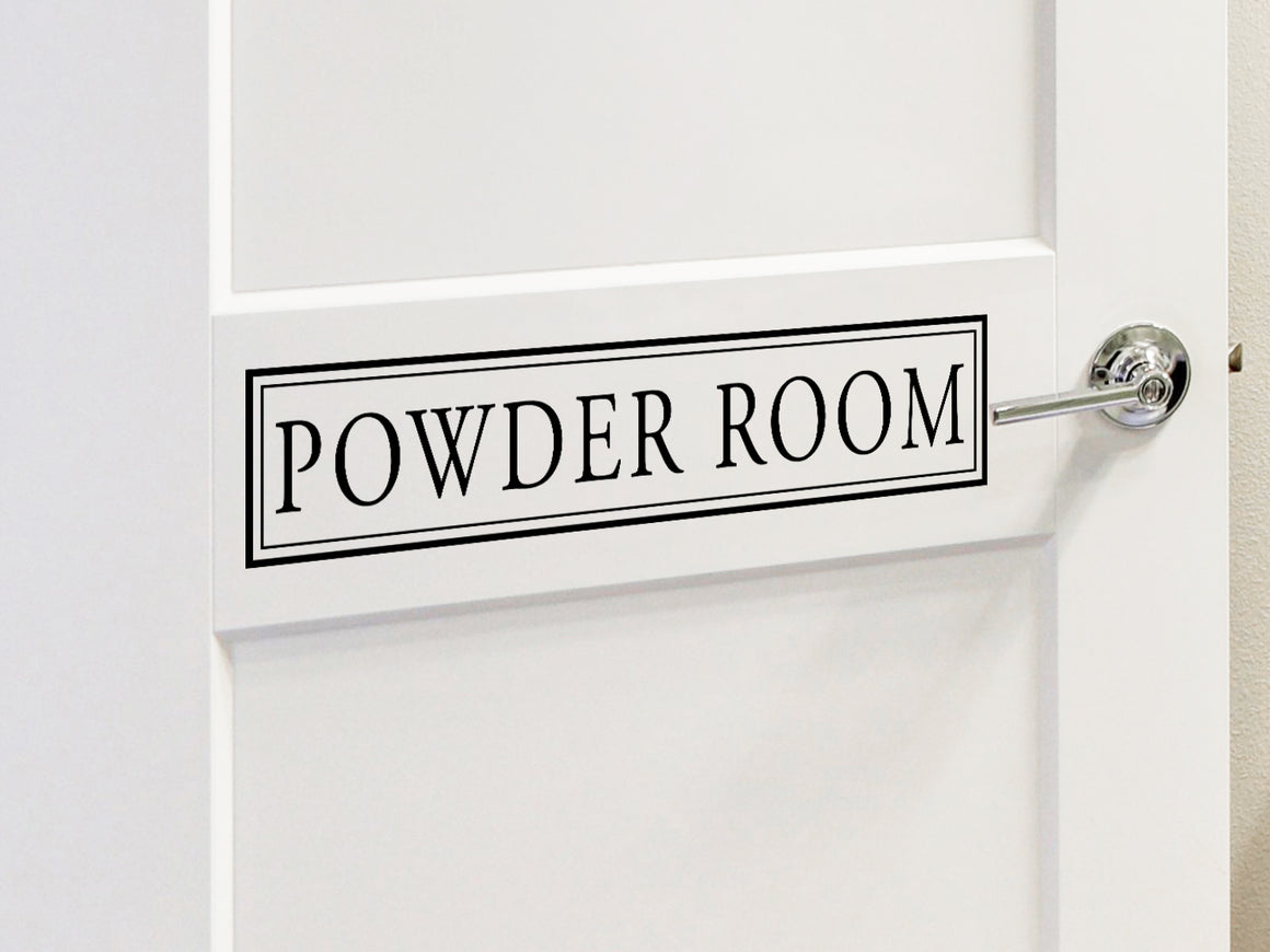 Wall decals for bathroom that say ‘powder room’ on a bathroom door.