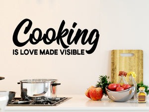 Wall decals for kitchen that say ‘Cooking is love made visible’ on a kitchen wall.