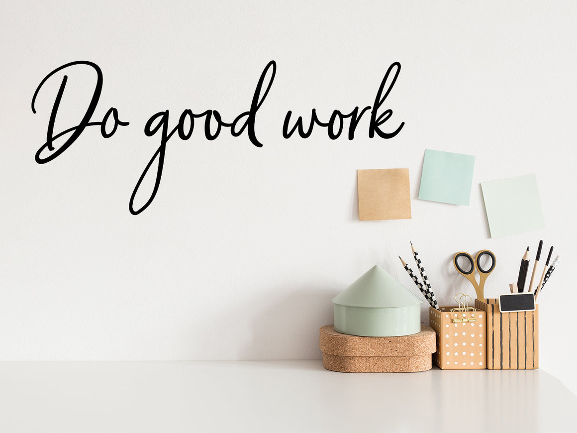Wall decal for the office that says ‘Do Good Work’ in a cursive font on an office wall.