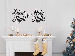 Living room wall decals that say ‘Silent Night Holy Night’ in a cursive font on a living room wall. 