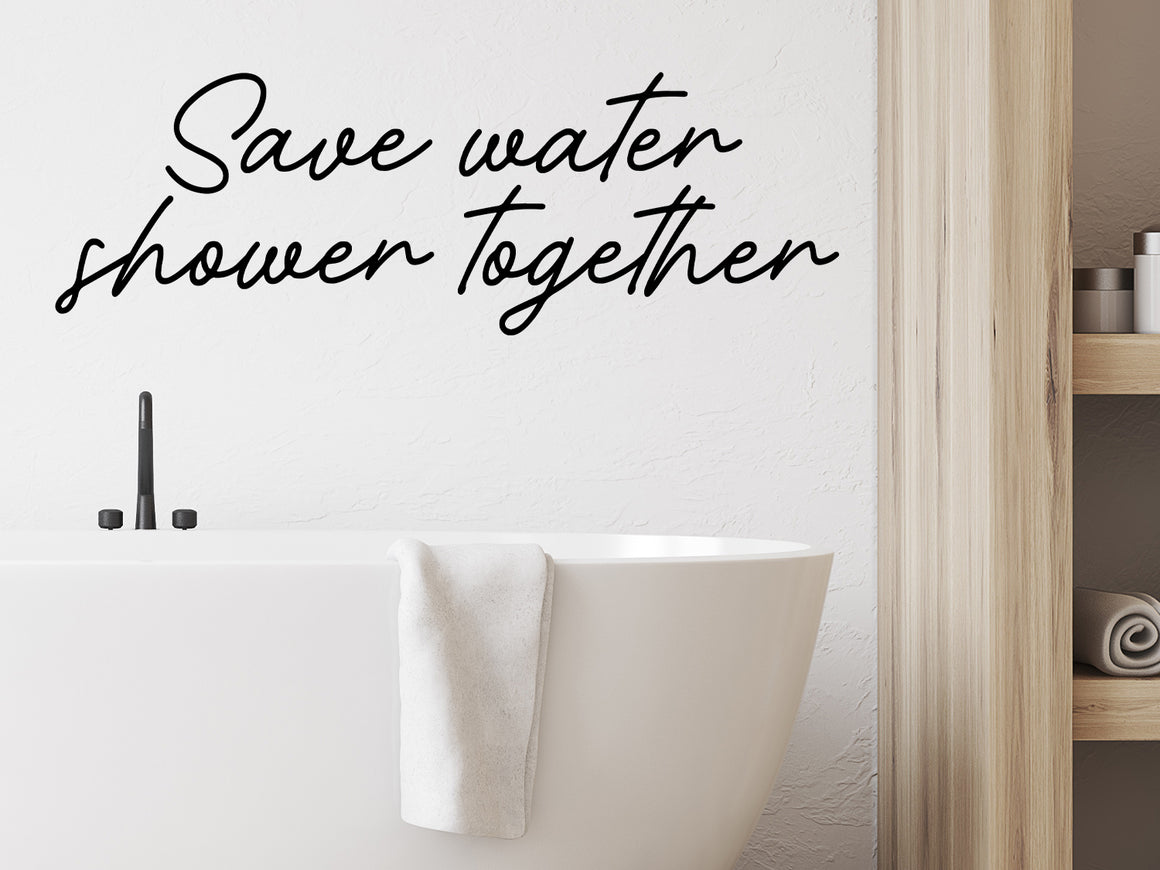 Wall decals for bathroom that say ‘save water shower together’ on a bathroom wall.