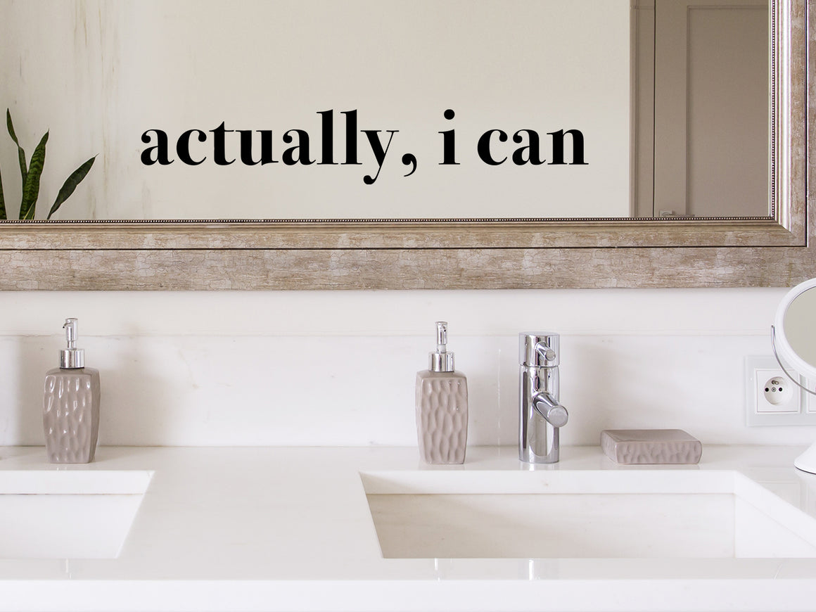 Wall decals for bathroom that say ‘Actually I Can’ in a print font on a bathroom wall.