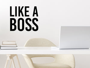 Wall decal for the office that says ‘Like A Boss’ in a bold font on an office wall.