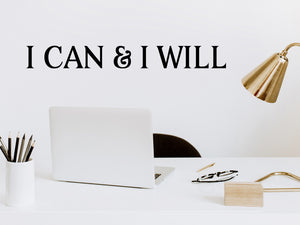Wall decal for the office that says ‘I Can & I Will’ in a print font on an office wall.