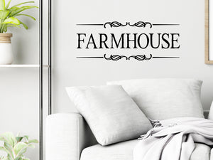 Living room wall decals that say ‘Farmhouse’ with ribbons on a living room wall. 