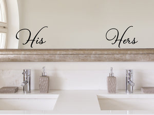 Wall decals for bathroom that say ‘His / Hers’ in script font on a bathroom mirror.