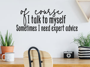 Decorative wall decal that says ‘Of Course I Talk To Myself Sometimes I Need Expert Advice’ on an office wall.
