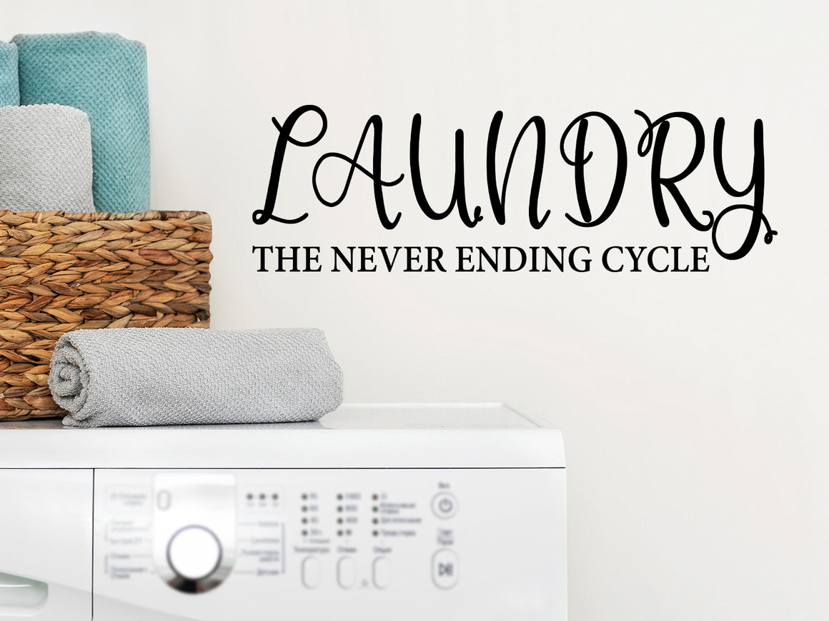 Laundry room wall decal that says ‘Laundry The Never Ending Cycle’ on a laundry room wall.