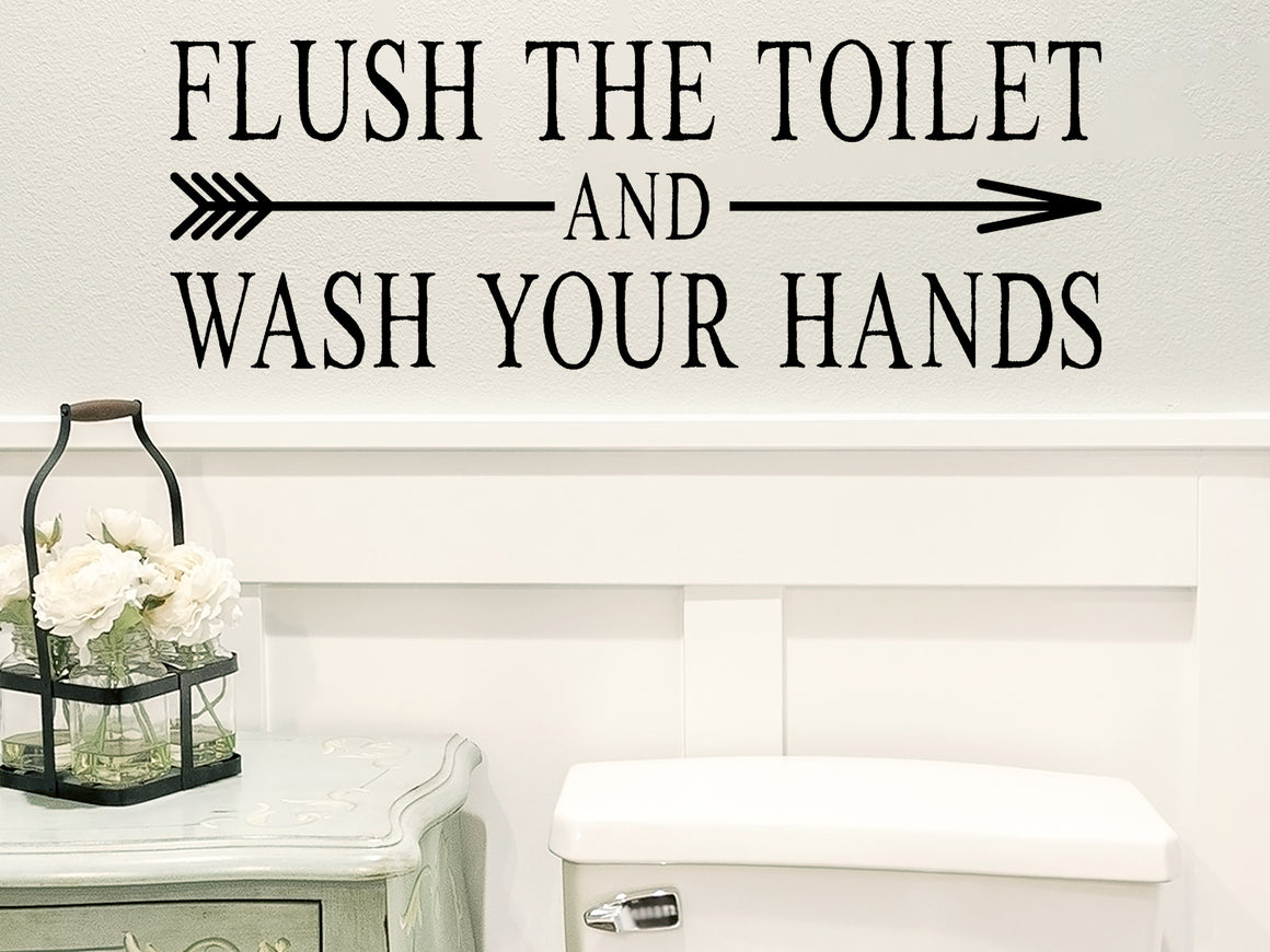 Wall decals for the bathroom that say 'Flush the toilet and wash your hands' on a bathroom wall. 