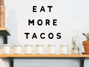 Wall decals for kitchen that say ‘eat more tacos’ on a kitchen wall.