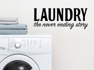 Laundry room wall decal that says ‘Laundry The Never Ending Story’ in a bold font on a laundry room wall.