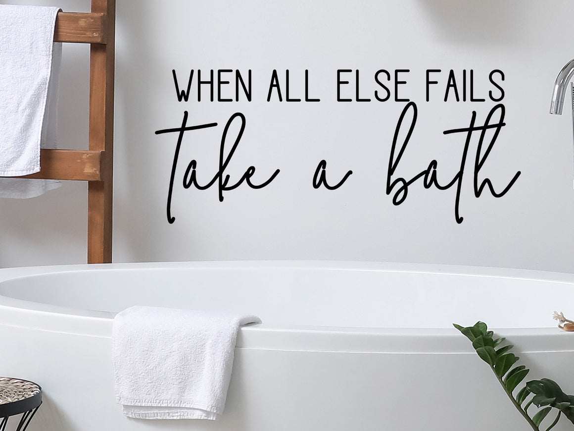 Wall decals for bathroom that say ‘When All Else Fails Take A Bath’ in a script font on a bathroom wall.