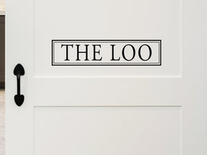 Wall decals for bathroom that say ‘the loo’ with boxes on a bathroom wall.