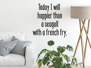 Living room wall decals that say ‘Today I will be happier than a seagull with a french fry’ in print on a living room wall. 