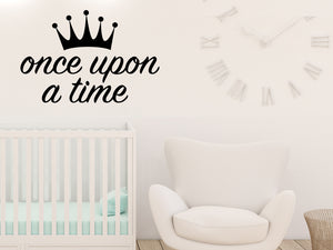 Wall decal for kids that says ‘Once Upon A Time’ in a script font on a kid’s room wall. 