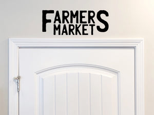 Wall decals for kitchen that say ‘Farmer's Market’ on a kitchen wall.