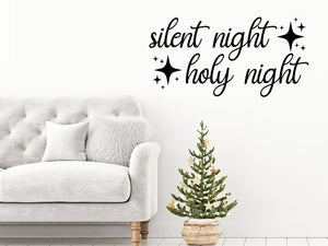 Living room wall decals that say ‘Silent Night Holy Night’ with stars on a living room wall. 