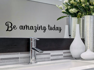 Wall decals for bathroom that say ‘Be Amazing Today’ in a cursive font on a bathroom wall.