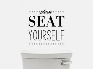 Wall decals for bathroom that say ‘please seat yourself’ on a bathroom wall.