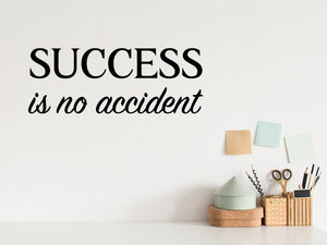 Wall decal for the office that says ‘Success Is No Accident’ in a bold font on an office wall.