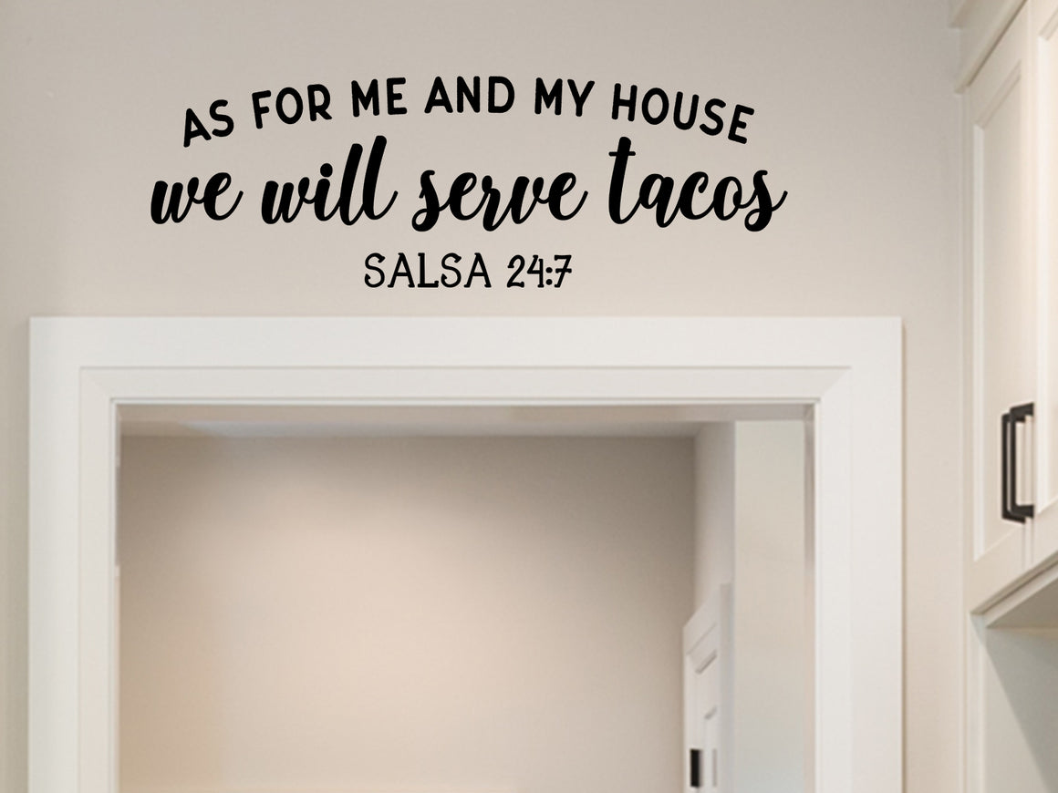 Wall decals for kitchen that say ‘As for me and my house we will serve tacos. Salsa 24:7’ on a kitchen wall.