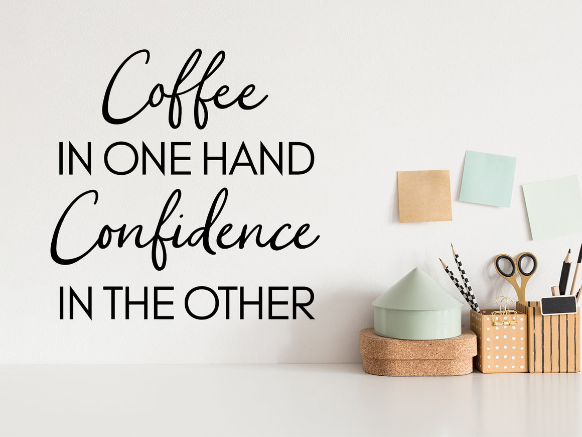 Wall decal for the office that says ‘Coffee In One Hand Confidence In The Other’ on an office wall.