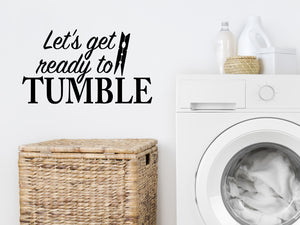 Laundry room wall decal that says ‘Let's Get Ready To Tumble' with a picture of a Clothes Pin on a laundry room wall