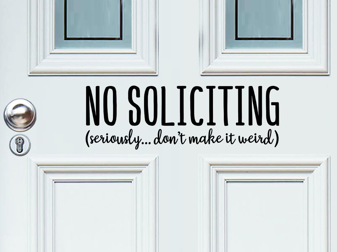 Front door decal that says, ‘No soliciting seriously don't make it weird’ on a front porch door. 