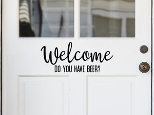 Front door decal that says, ‘Welcome Did You Bring Beer?’ on a front porch door. 