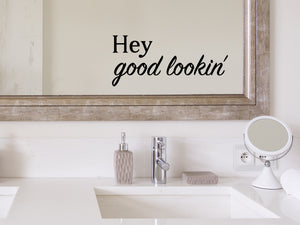 Wall decals for bathroom that say ‘Hey Good Lookin’ in a bold font on a bathroom wall.