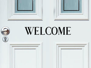 Front door decal that says, ‘Welcome’ on a front porch door. 