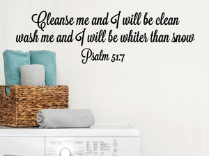 Laundry room wall decal that says ‘cleanse me and I will be clean wash me and I will be whiter than snow Psalm 51:7’ on a laundry room wall.
