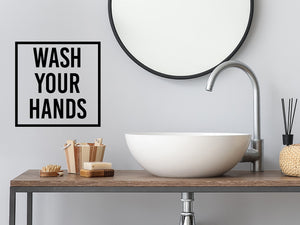 Wall decals for bathroom that say ‘Wash Your Hands’ with a square design on a bathroom wall.