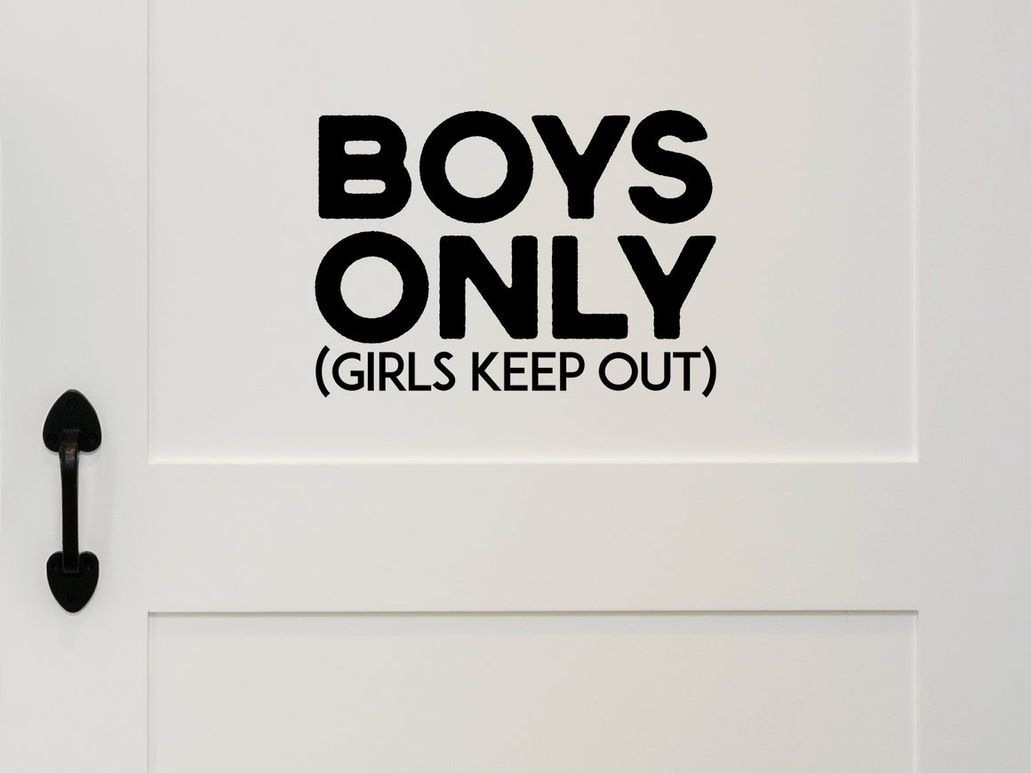 Wall decal for kids that says ‘Girls Keep Out Boys Only’ in a bold font on a kid’s room wall. 