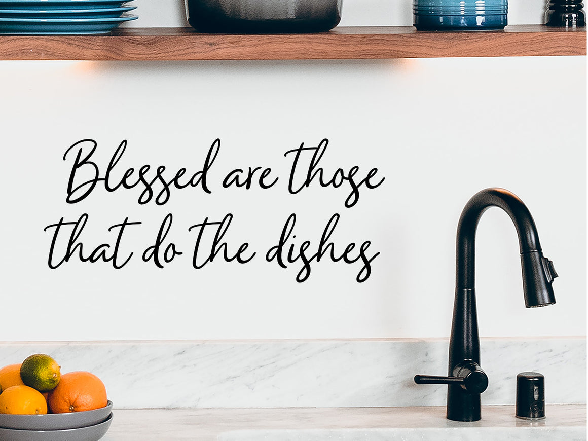 Wall decals for kitchen that say ‘Blessed Are Those Who Do The Dishes’ on a kitchen wall.