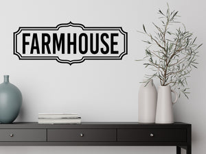 Living room wall decals that say ‘Farmhouse’ on a living room wall. 