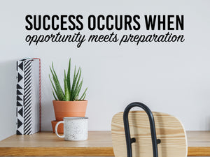 Wall decal for the office that says ‘Success Occurs When Opportunity Meets Preparation’ in a bold font on an office wall.