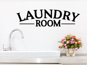 Laundry room wall decal in black that says ‘laundry room’ on a laundry room wall.
