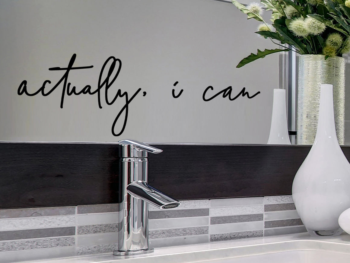 Wall decal for the bathroom that says ‘Actually, I Can’ on a bathroom mirror.