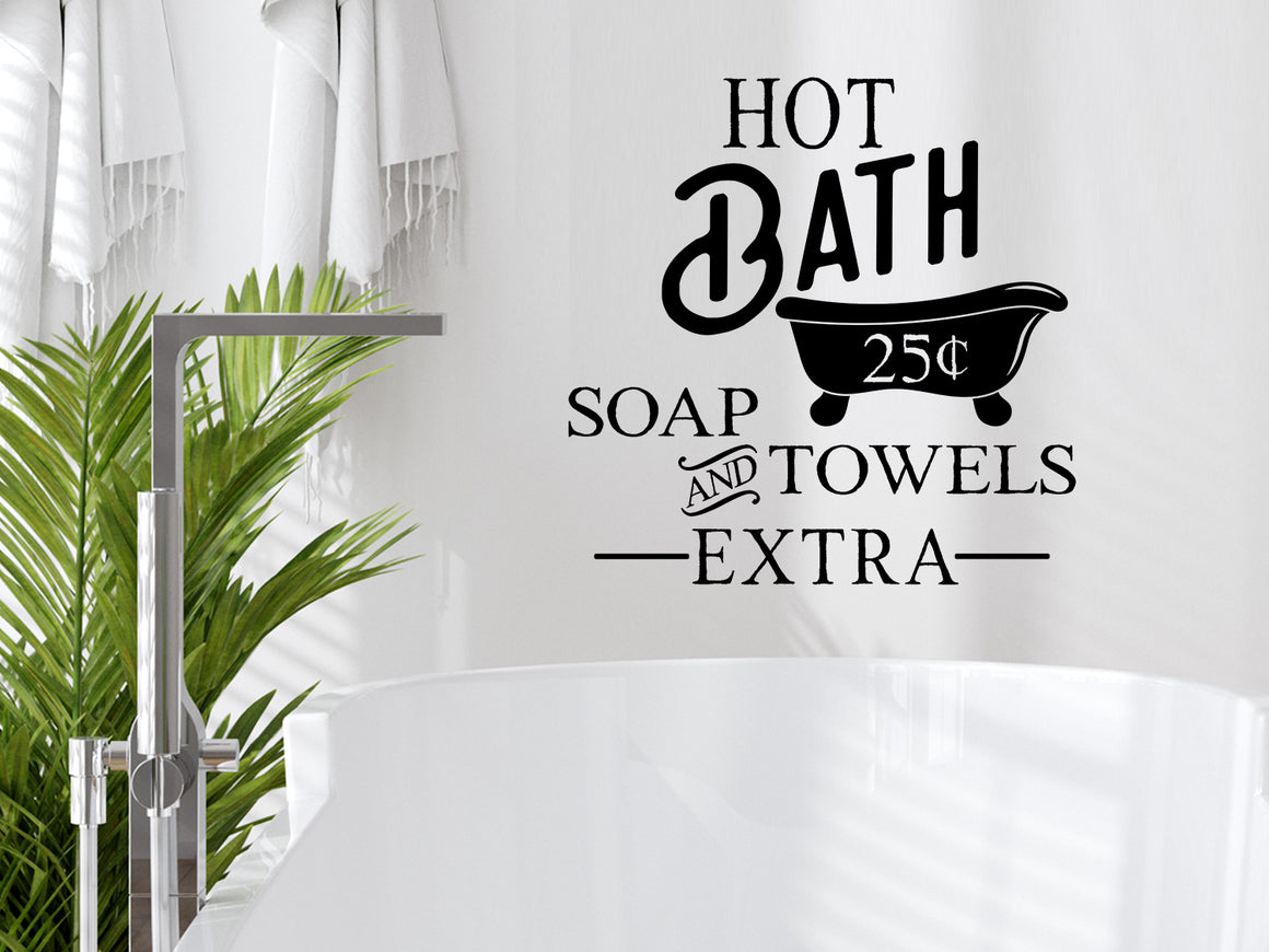 Wall decals for bathroom that say ‘Hot Baths 25 Cents... Soap And Towels Extra’ in a bold font on a bathroom wall.