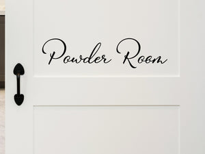 Wall decals for bathroom that say ‘Powder Room’ in a cursive font on a bathroom door.
