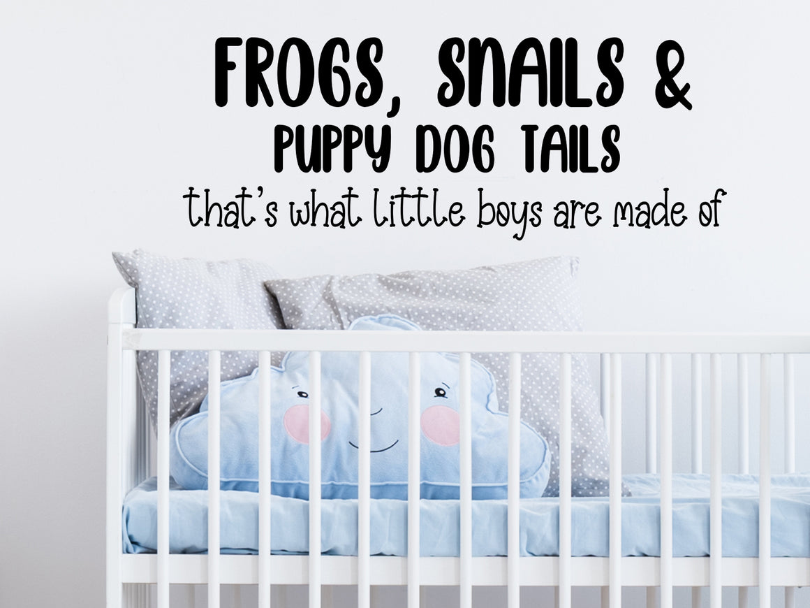 Wall decal for kids that says ‘Frogs, snails and puppy dog tails that's what little boys are made of’ on a kid’s room wall. 