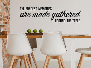 Wall decals for kitchen that say ‘The Fondest Memories Are Made Gathered Around The Table’ in a bold font on a kitchen wall.