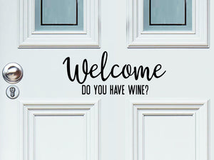 Front door decal that says, ‘Welcome Did You Bring Wine?’ on a front porch door. 