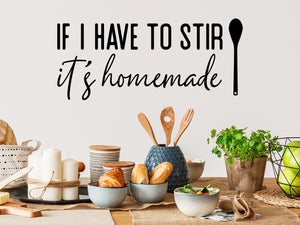 Wall decals for kitchen that say ‘If I Have To Stir It It's Homemade’ in a print font on a kitchen wall.
